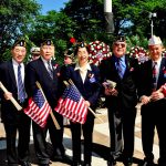 NYC: Chinese-American War Veterans from the Lt. B. R. Kimlau Chinese Memorial Post 1291, the American Legion, at the annual Memorial Day ceremonies at the Soldiers' and Sailors' Monument in Riverside Park 27 May 2013 with Commander Mimi Wang in the center